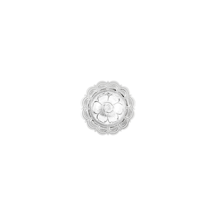Silver floral concho on a white background